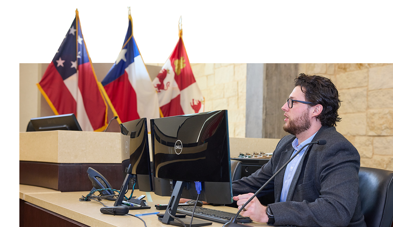 An image of Town Secretary Joshua Stevenson working in the Town Council chambers
