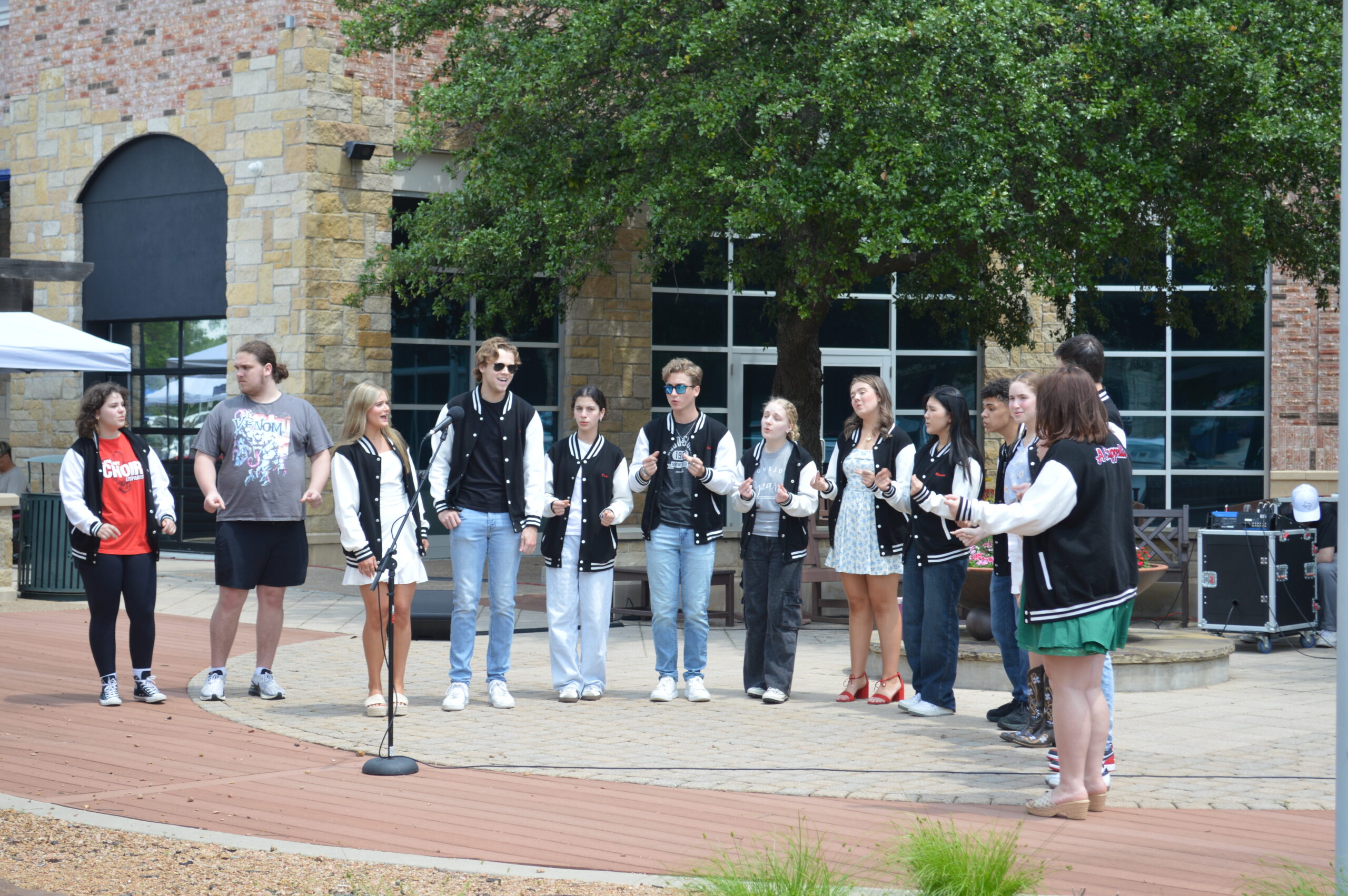 Image of members of the Lovejoy A Cappella Choir singing at an event