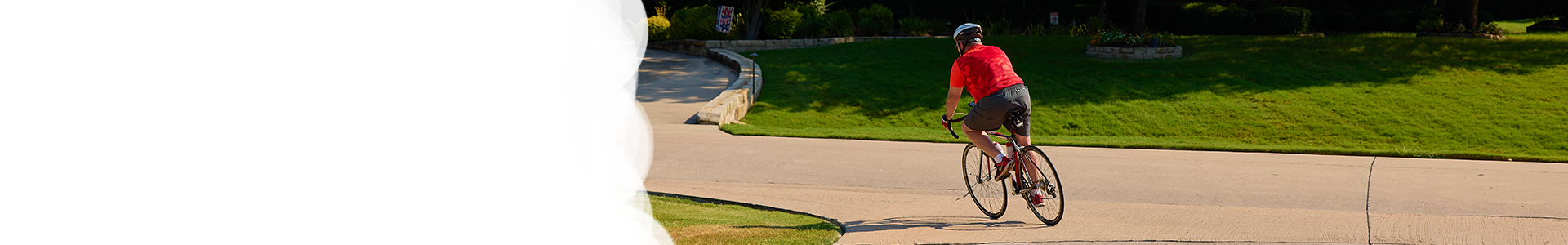 An image of a person riding a bicycle on a Fairview residential street.