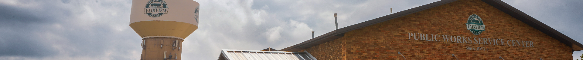 An image of the exterior of the Public Works building adjacent to a Fairview water tower