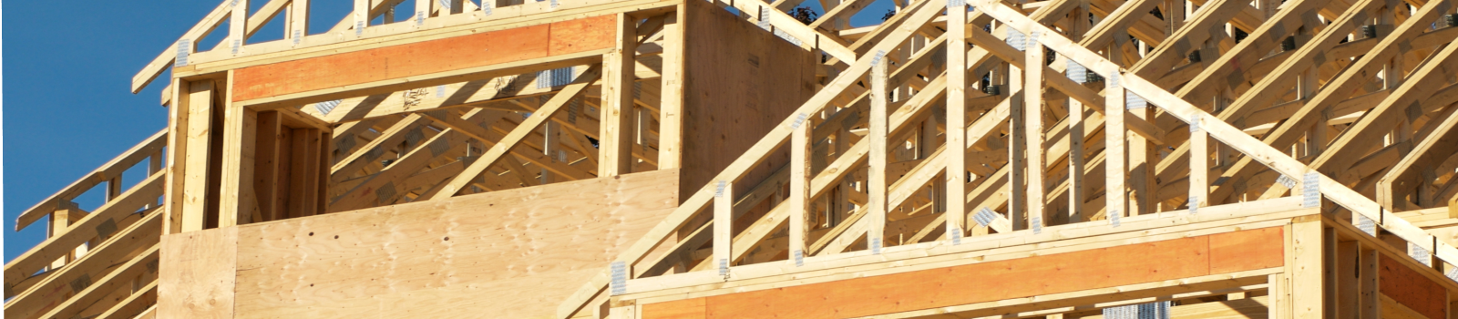 An image of the wood framework of a house under construction