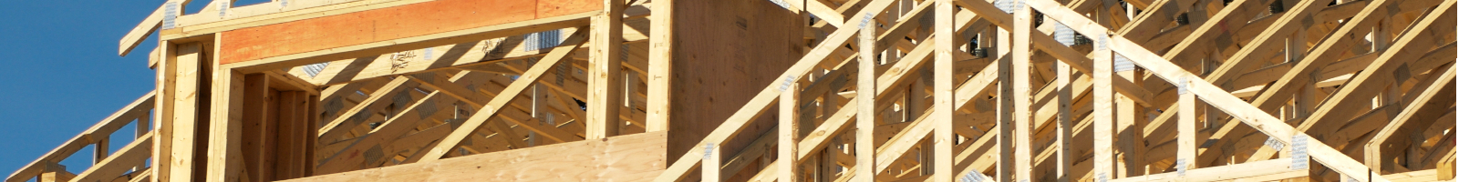 An image of the wood framework of a house under construction