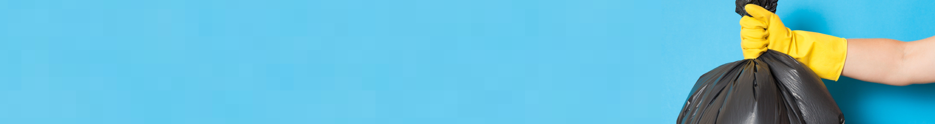 An image of a hand wearing a rubber glove holding a trash bag